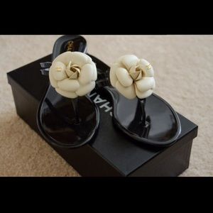 Chanel
Black Leather with Cream Camellia